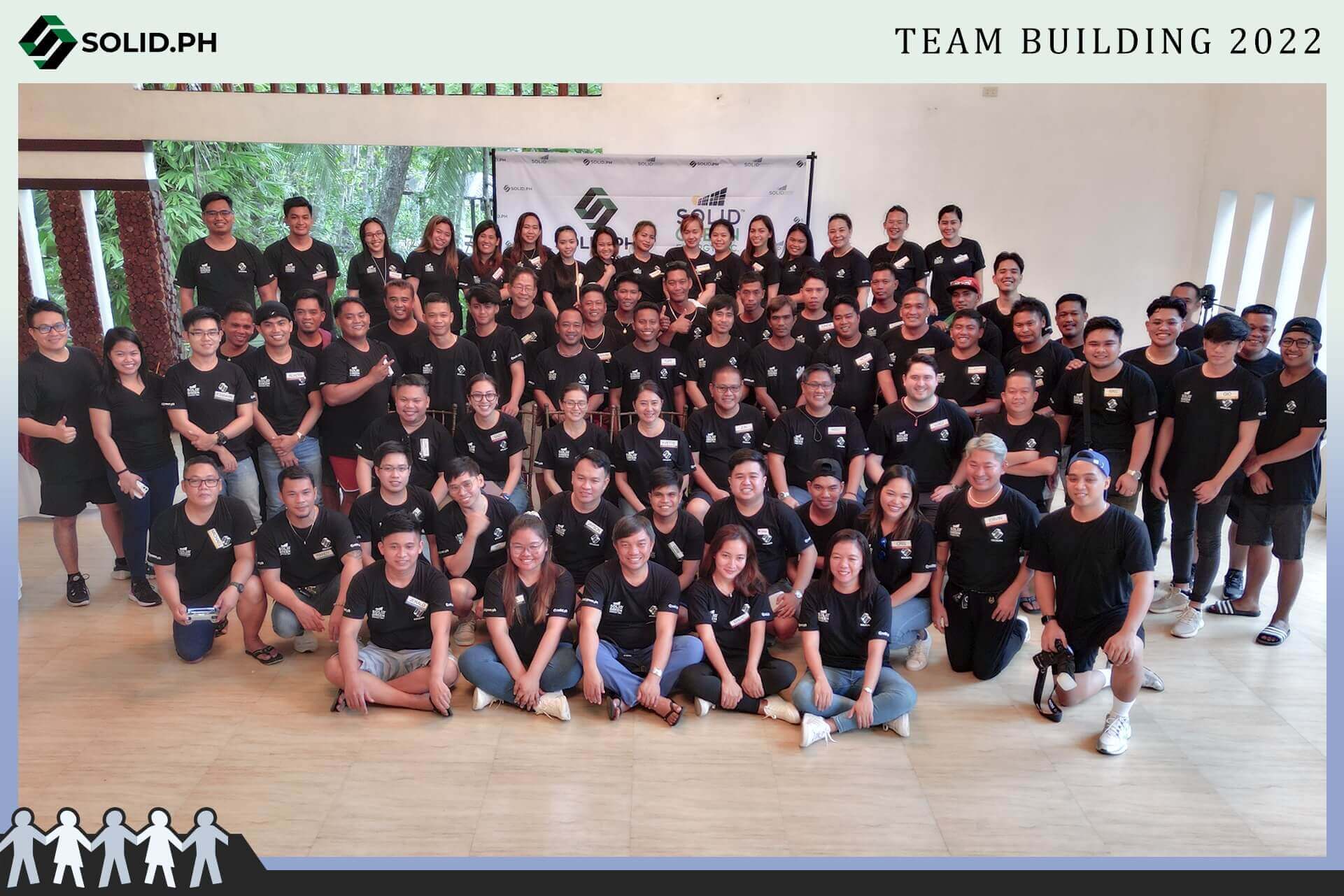 A large group of Solid.PH employees pose for a team building photo in 2022.