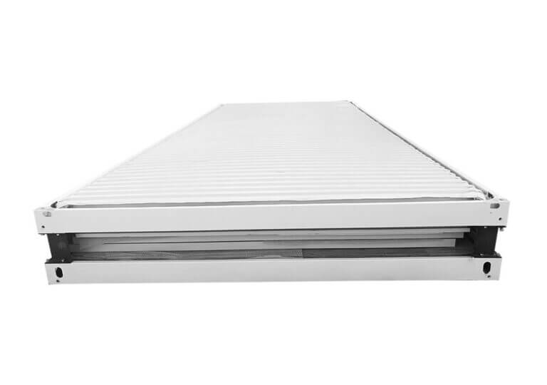 A partially-folded, white metal structure with a ridged top.