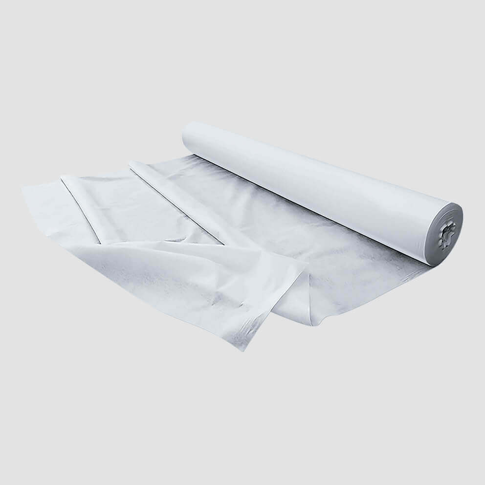 A roll of white geotextile fabric, partially unrolled.